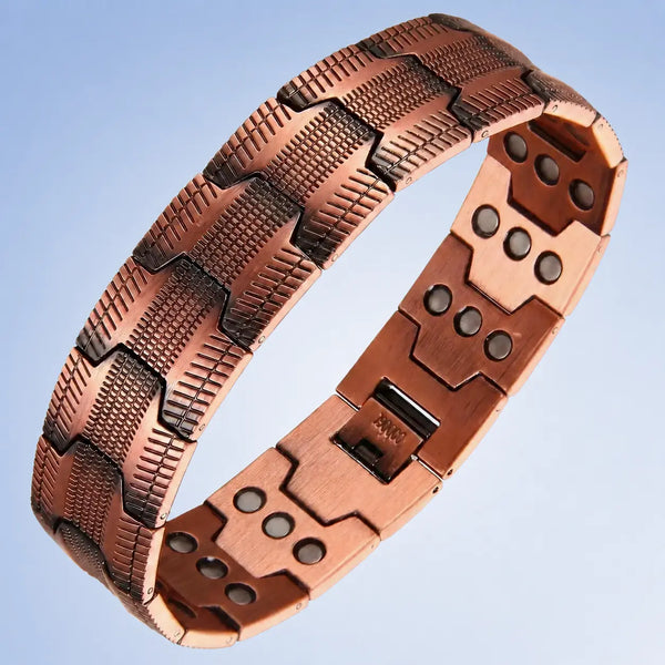 A copper-colored magnetic therapy link bracelet shown on a light blue gradient background.